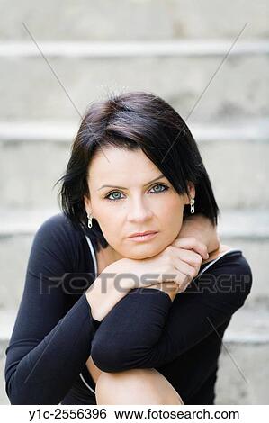 Stock Photograph - Pretty young woman portrait dark-haired. Fotosearch