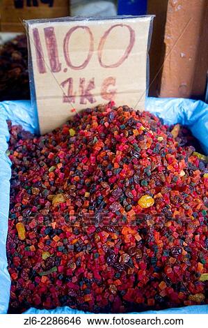 Stock Photograph - Red and colorful dry raisins in India Street and Gambier street are streets in Kuching City, fronting the Sarawak River. Many bulk spices both whole and ground, dried fruits, pastas and chips, and different varieties of dhals are for sale.. Fotosearch