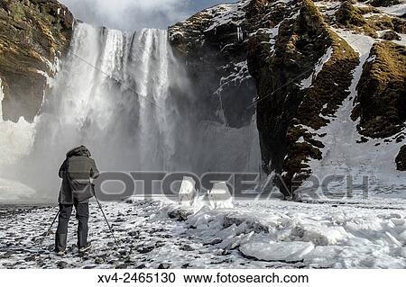 Skogafoss waterfall in winter, Iceland. View Large Photo Image Stock Image - Skogafoss waterfall in winter, Iceland.. Fotosearch