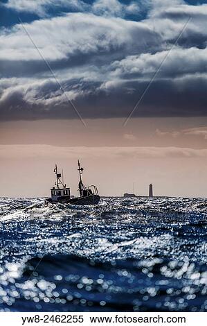 Stock Photography - Small fishing boat in Reykjavik Harbor, Reykjavik, Iceland.. Fotosearch