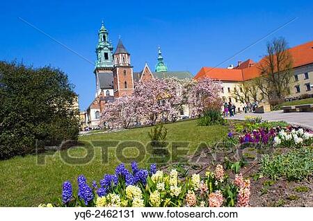 Stock Image - Spring garden at Krakows Royal Wawel Castle with Wawel Cathedral in the background, Krakow, Poland, Europe.. Fotosearch