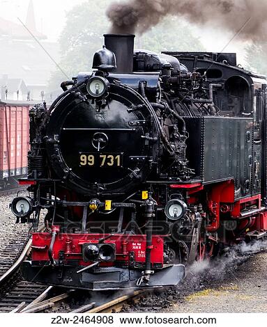 Steam train on the Zittau Railway, Saxony, Germany. A narrow gauge steam railway serving the mountain spa resorts of Oybin and Jonsdorf in the Zittau Mountains in southeast Saxony. View Large Photo Image Stock Photo - Steam train on the Zittau Railway, Saxony, Germany. A narrow gauge steam railway serving the mountain spa resorts of Oybin and Jonsdorf in the Zittau Mountains in southeast Saxony.. Fotosearch