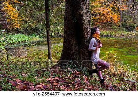 Stock Photo - Stock Photo - Short-haired teenager girl in woodland.. Fotosearch