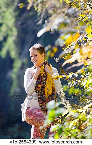 Stock Photo - Stock Photo - Teen girl in forest under sun. Fotosearch