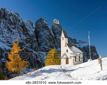 The chapel at Groedner Joch - Passo Gardena in the Dolomites of South Tyrol - Alto Adige. The Dolomites are listed as UNESCO World heritage. europe, central europe, italy, october. View Large Photo Image Stock Image - The chapel at Groedner Joch - Passo Gardena in the Dolomites of South Tyrol - Alto Adige. The Dolomites are listed as UNESCO World heritage. europe, central europe, italy, october.. Fotosearch