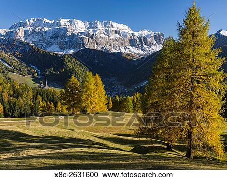 The Sella Mountain Range in the Dolomites of South Tyrol - Alto Adige, seen from the Groeden Valley - Val Gardena. The village Wolkenstein - Selva in the valley. The Dolomites are listed as UNESCO World heritage. europe, central europe, italy, october. View Large Photo Image Stock Image - The Sella Mountain Range in the Dolomites of South Tyrol - Alto Adige, seen from the Groeden Valley - Val Gardena. The village Wolkenstein - Selva in the valley. The Dolomites are listed as UNESCO World heritage. europe, central europe, italy, october.. Fotosearch