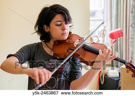 Tilburg, Netherlands. Young Italian violinist practising and rehearsing, in preparation of her conservatoire exam. View Large Photo Image Stock Photo - Tilburg, Netherlands. Young Italian violinist practising and rehearsing, in preparation of her conservatoire exam.. Fotosearch