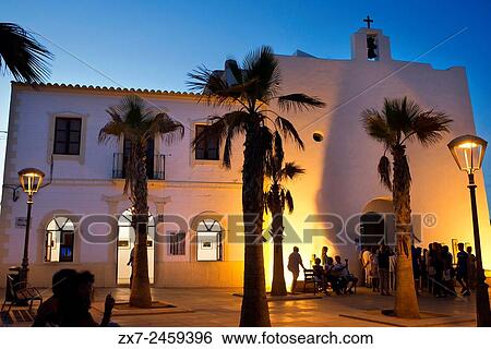 Stock Photograph - Tourists, Church in main square of Sant Francesc Xavier, San Francisco Javier, Formentera, Pityuses, Balearic Islands, Spain, Europe.. Fotosearch