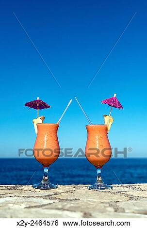 Tropical cocktail beverages at a island resort. View Large Photo Image Stock Photograph - Tropical cocktail beverages at a island resort.. Fotosearch