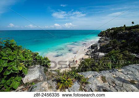 Tulum is the site of a Pre-Columbian Maya walled city serving as a major port for Cob. Daily tour buses bring a constant stream of visitors to the site. View Large Photo Image Stock Photography - Tulum is the site of a Pre-Columbian Maya walled city serving as a major port for Cob. Daily tour buses bring a constant stream of visitors to the site.. Fotosearch