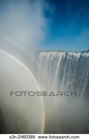 Victoria Falls, Zimbabwe - Victoria Falls Waterfall with rainbow. View Large Photo Image Stock Photography - Victoria Falls, Zimbabwe - Victoria Falls Waterfall with rainbow.. Fotosearch