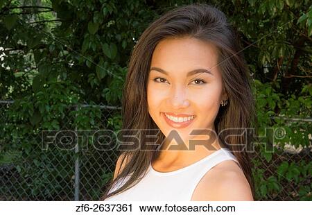 Vietnamese American young woman age 30s portrait outdoors smiling MR-8 Model Released. View Large Photo Image Stock Image - Vietnamese American young woman age 30s portrait outdoors smiling MR-8 Model Released.. Fotosearch