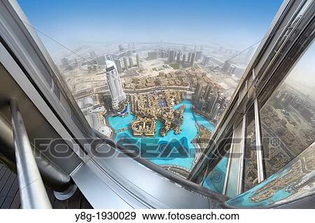 Stock Photo - View of Dubai city center from terrace on the 124 floor of Burj Khalifa Tower, Dubai, United Arab Emirates. Fotosearch