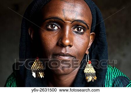 Woman belonging to the Afar tribe ( Afar state, Ethiopia). She is her husband first wife in a polygamous marriage. View Large Photo Image Stock Image - Woman belonging to the Afar tribe ( Afar state, Ethiopia). She is her husband first wife in a polygamous marriage.. Fotosearch