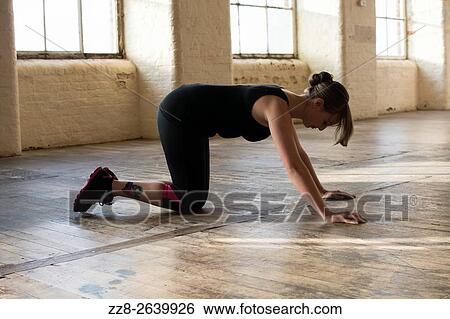 Stock Photograph - Woman doing pushups.. Fotosearch