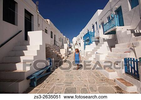 Woman walking in the narrow streets of the old town Castro, Folegandros, Cyclades Islands, Greek Islands, Greece, Europe. View Large Photo Image Stock Image - Woman walking in the narrow streets of the old town Castro, Folegandros, Cyclades Islands, Greek Islands, Greece, Europe.. Fotosearch