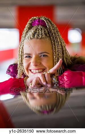 Woman with afro braided-hair happy atop car roof View Large Photo Image Stock Image - Woman with afro braided-hair happy atop car roof. Fotosearch