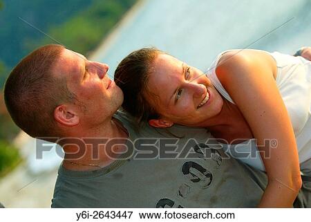 Young couple embrace Teluk Nipah beach Pulau Pangkor island Malaysia. View Large Photo Image Stock Photo - Young couple embrace Teluk Nipah beach Pulau Pangkor island Malaysia.. Fotosearch