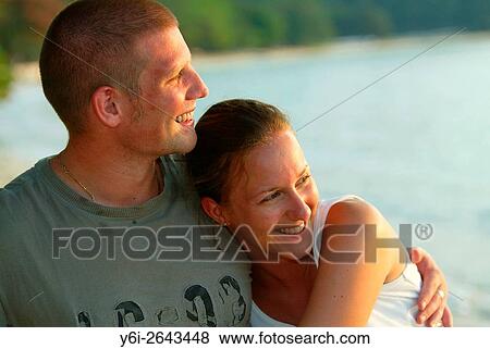 Young couple embrace Teluk Nipah beach Pulau Pangkor island Malaysia. View Large Photo Image Stock Photo - Young couple embrace Teluk Nipah beach Pulau Pangkor island Malaysia.. Fotosearch