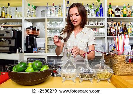 Young female bartender preparing cocktails. Woman barman at work. View Large Photo Image Stock Photo - Young female bartender preparing cocktails. Woman barman at work.. Fotosearch