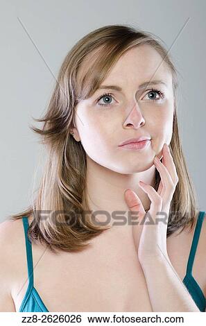 Young woman thinking View Large Photo Image Stock Photograph - Young woman thinking. Fotosearch