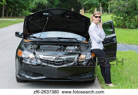 Young woman with car broken down on side of road using cell phone to call for help and being rather annoyed MR Model released. View Large Photo Image Stock Image - Young woman with car broken down on side of road using cell phone to call for help and being rather annoyed MR Model released.. Fotosearch
