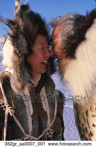Inupiat Eskimo Man & Woman Rubbing Noses Nome AK Winter Stock Image