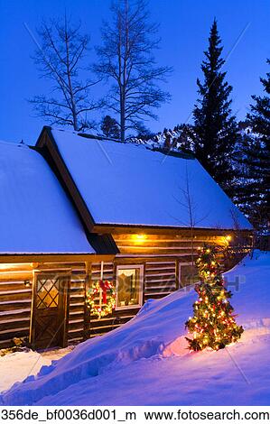 Holiday Decorated Cabin W Lighted Christmas Tree In Yard Near