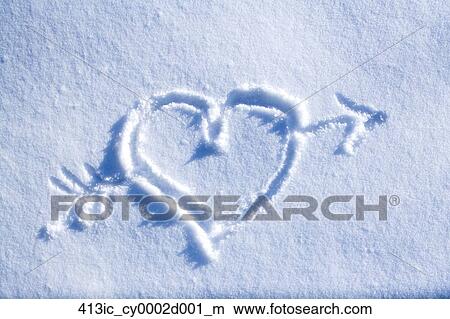 stock photo of drawing of heart with arrow through it in blanket of