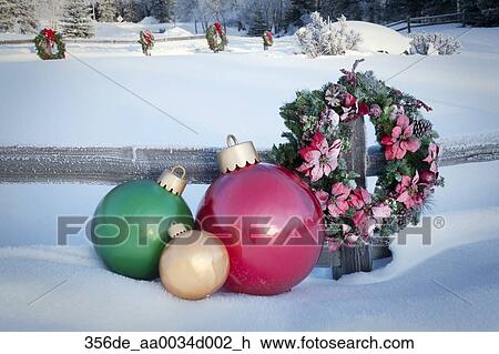 Split Rail Fence Decorated With Christmas Wreaths And Decorations