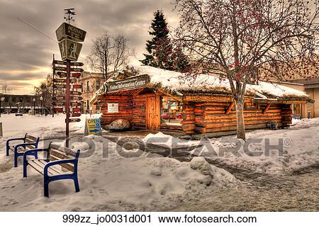 Log Cabin Visitor Center And Milepost Sign Covered In Snow