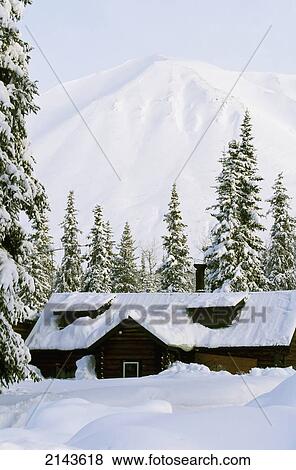 Log Cabin In Forest Deep Snow Winter Kp Alaska Stock Photo