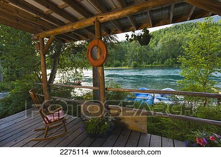 Rustic Cabin Porch With Chair At Alaska Rivers Company In Cooper