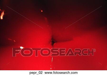 Stock Image - red pepper, wet, shiny, vegetable, food, cooking, tight close-up. Fotosearch