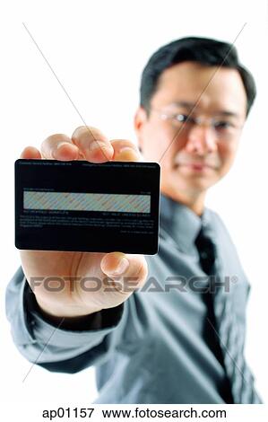 Businessman holding credit card View Large Photo Image Stock Photo - Businessman holding credit card. Fotosearch
