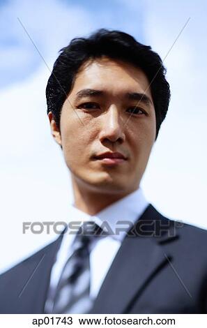 Businessman, looking at camera, head shot View Large Photo Image Stock Image - Businessman, looking at camera, head shot. Fotosearch