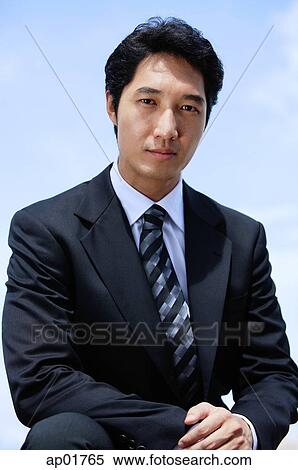 Stock Photography - Businessman looking at camera. Fotosearch