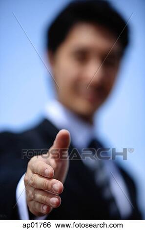 Stock Photograph - Businessman offering hand for handshake, selective focus. Fotosearch