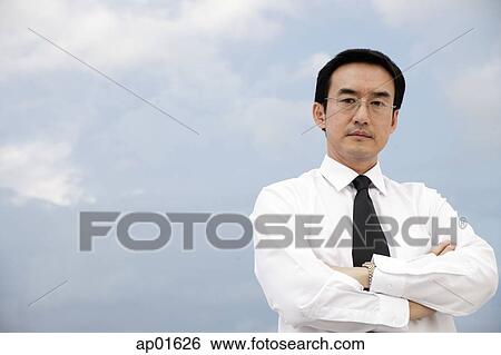 Businessman with arms crossed View Large Photo Image Stock Photograph - Businessman with arms crossed. Fotosearch