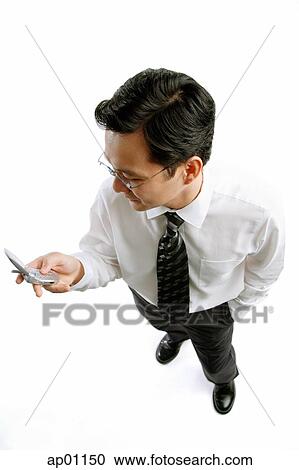 Stock Image - Businessman with mobile phone. Fotosearch