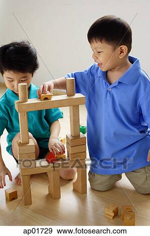 Children playing with building blocks View Large Photo Image Stock Photo - Children playing with building blocks. Fotosearch