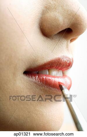 Close up of woman's mouth, putting on lipstick with lip brush View Large Photo Image Stock Image - Close up of woman's mouth, putting on lipstick with lip brush. Fotosearch