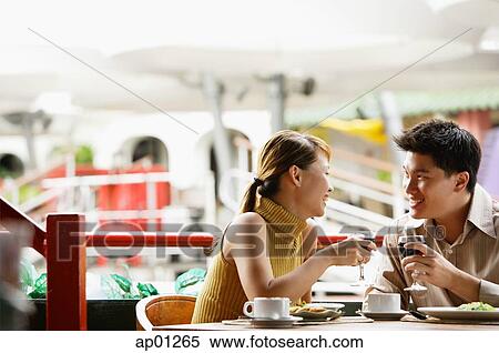 Couple dining in cafe View Large Photo Image Stock Photography - Couple dining in cafe. Fotosearch