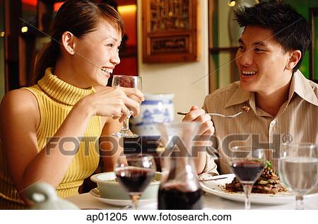 Stock Photography - Couple dining in restaurant. Fotosearch