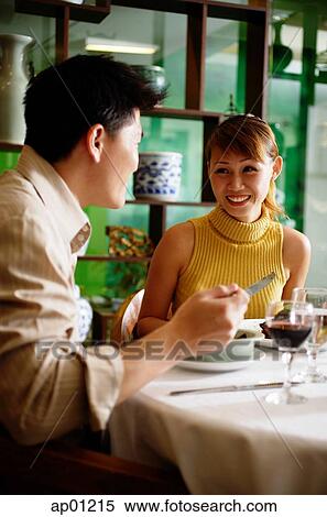 Couple eating in Chinese restaurant View Large Photo Image Stock Photography - Couple eating in Chinese restaurant. Fotosearch