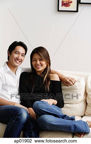Couple in living room View Large Photo Image Stock Image - Couple in living room. Fotosearch
