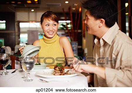 Picture - Couple in restaurant, dining. Fotosearch