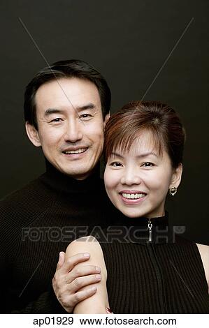 Couple smiling at camera, portrait View Large Photo Image Stock Photo - Couple smiling at camera, portrait. Fotosearch