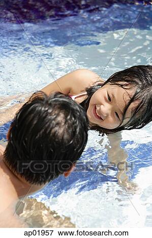 Father and daughter in swimming pool View Large Photo Image Stock Photo - Father and daughter in swimming pool. Fotosearch