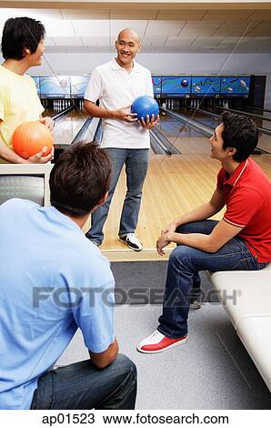 Four men in bowling alley View Large Photo Image Stock Image - Four men in bowling alley. Fotosearch